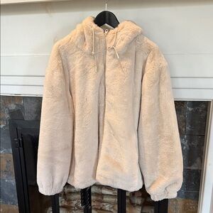 Faux Fur Hooded Jacket in Cream. Zipper close. Side pockets with zippers. XL.